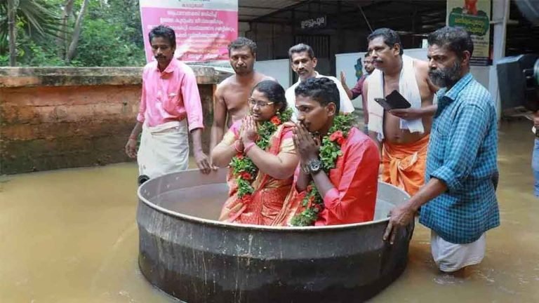 Kerala Couple Reaches Flooded Hall in Cooking Vessel