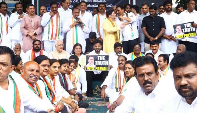 After Handshake At Davos, Revanth Reddy Protest Against Adani
