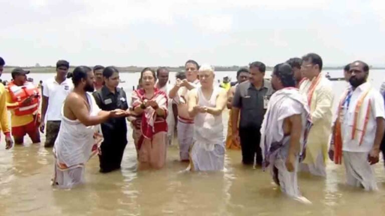 Governor Couple Takes Holy Bath During Saraswati